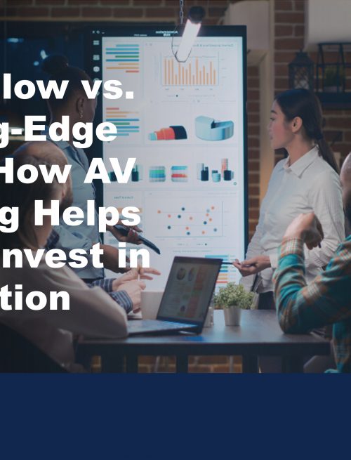 Image of a business meeting using a digital display board to illustrate the benefits of AV leasing to SMEs